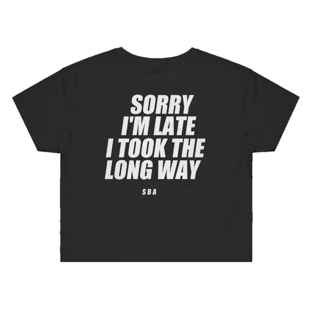 SORRY I'M LATE I TOOK THE LONG WAY printed in white across the back of a black womens crop tee. Street Bikes Addicts.